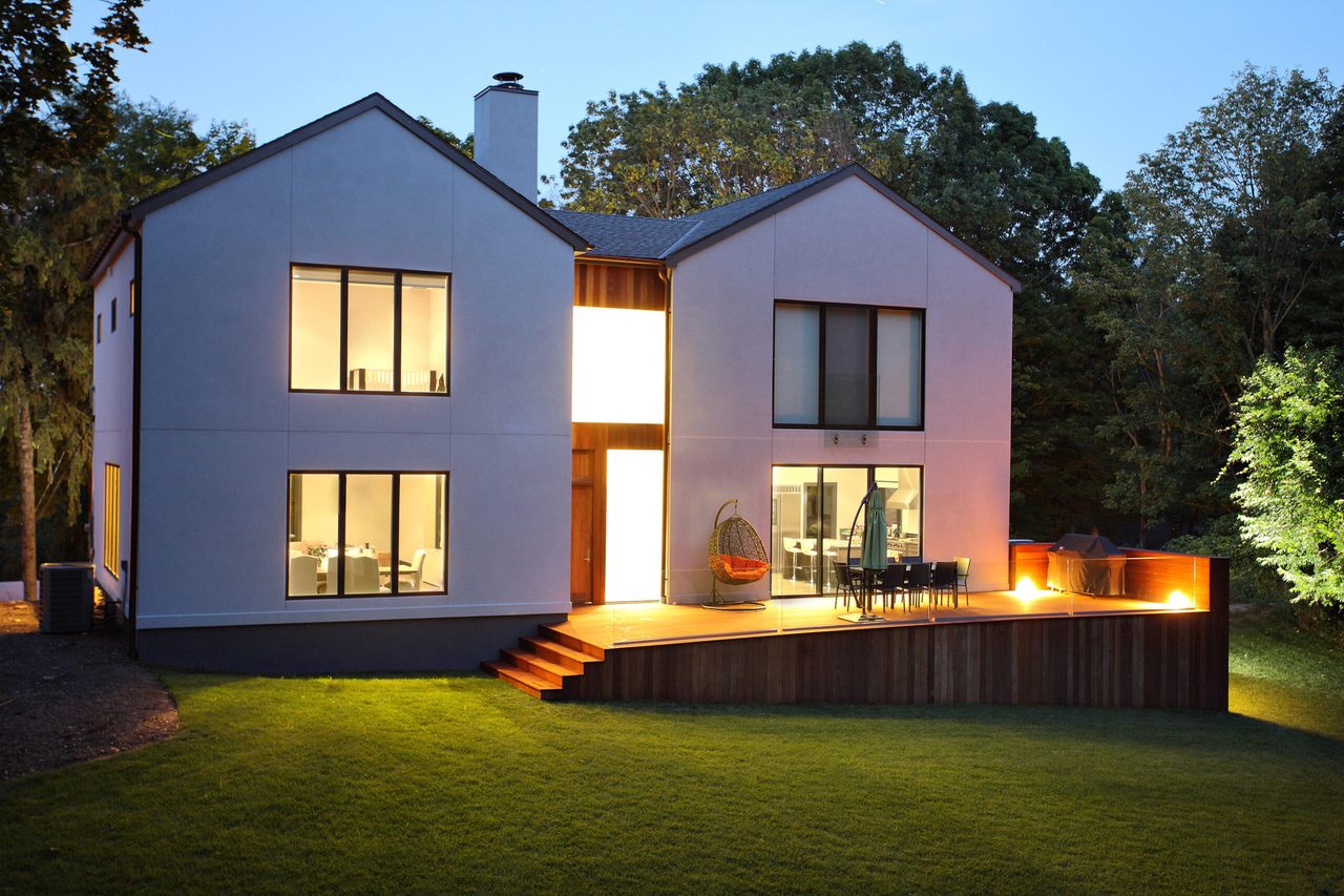A modern house and garden in low evening light